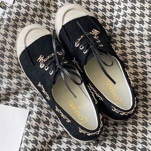 Women's CHANEL Black and Beige Suede Lace-Up Sneakers with Gold Chain Trim